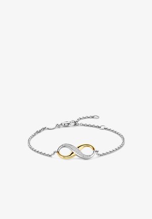 Armband aus Silber mit einem Unendlichkeitssymbol in Gold und Silber, wobei eine Seite mit kleinen klaren Steinen verziert ist.