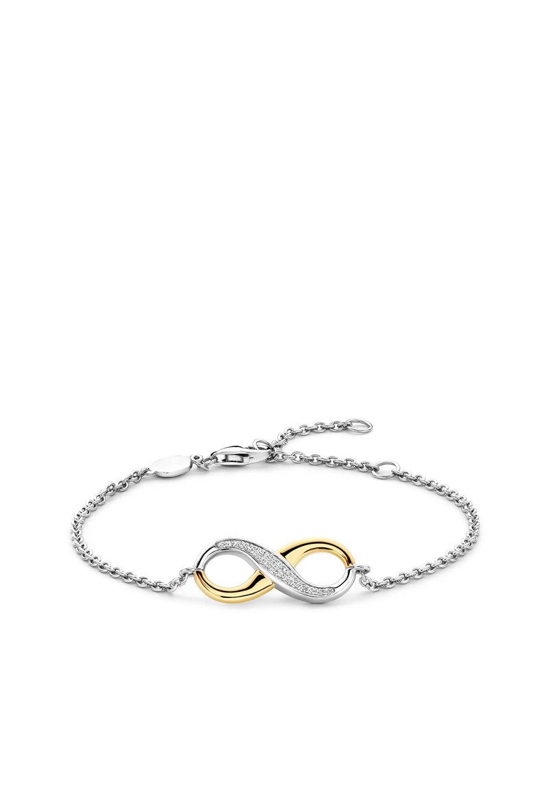 Zilveren kettingarmband met een oneindigheidssymbool in goud en zilver, waarbij één kant is versierd met kleine heldere steentjes.