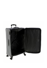 Valigia nera con esterno rigido, manico retraibile, quattro ruote, interno spazioso vuoto con motivo nero e tasca con cerniera.