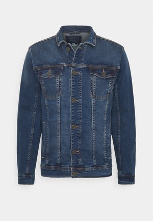 Blå denimjakke med knaplukning foran, to brystlommer og en let slidt tekstur. Har en klassisk krave og lange ærmer.