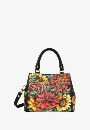 Leren handtas met een bloemenpatroon in rood, oranje, geel en groene tinten. Voorzien van zwarte handvatten en een afneembare schouderriem.