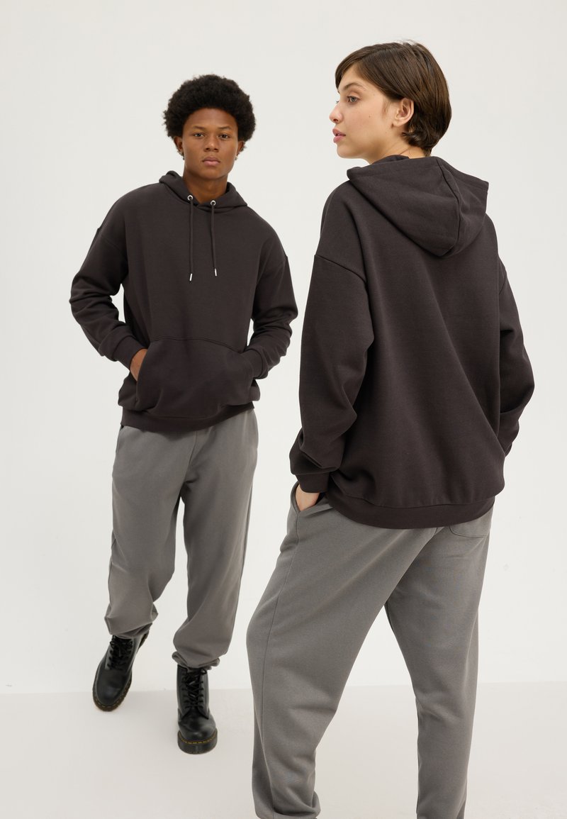 Thermo bloes met capuchon grijs Thermo bloes met capuchon grijs