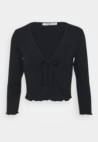 Svart ribbad långärmad topp med V-ringning, framslutsnörning och scallopkant. Har en åtsittande design för en snug fit.