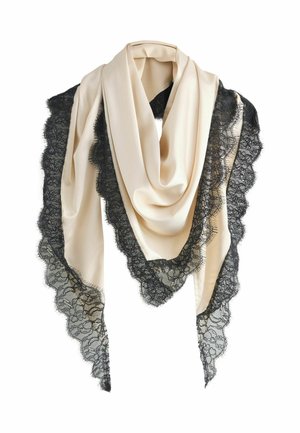 Krém színű selyemsál fekete csipkével díszítve, hullámos széllel. Az anyag sima, finom, bonyolult csipkedíszítéssel.