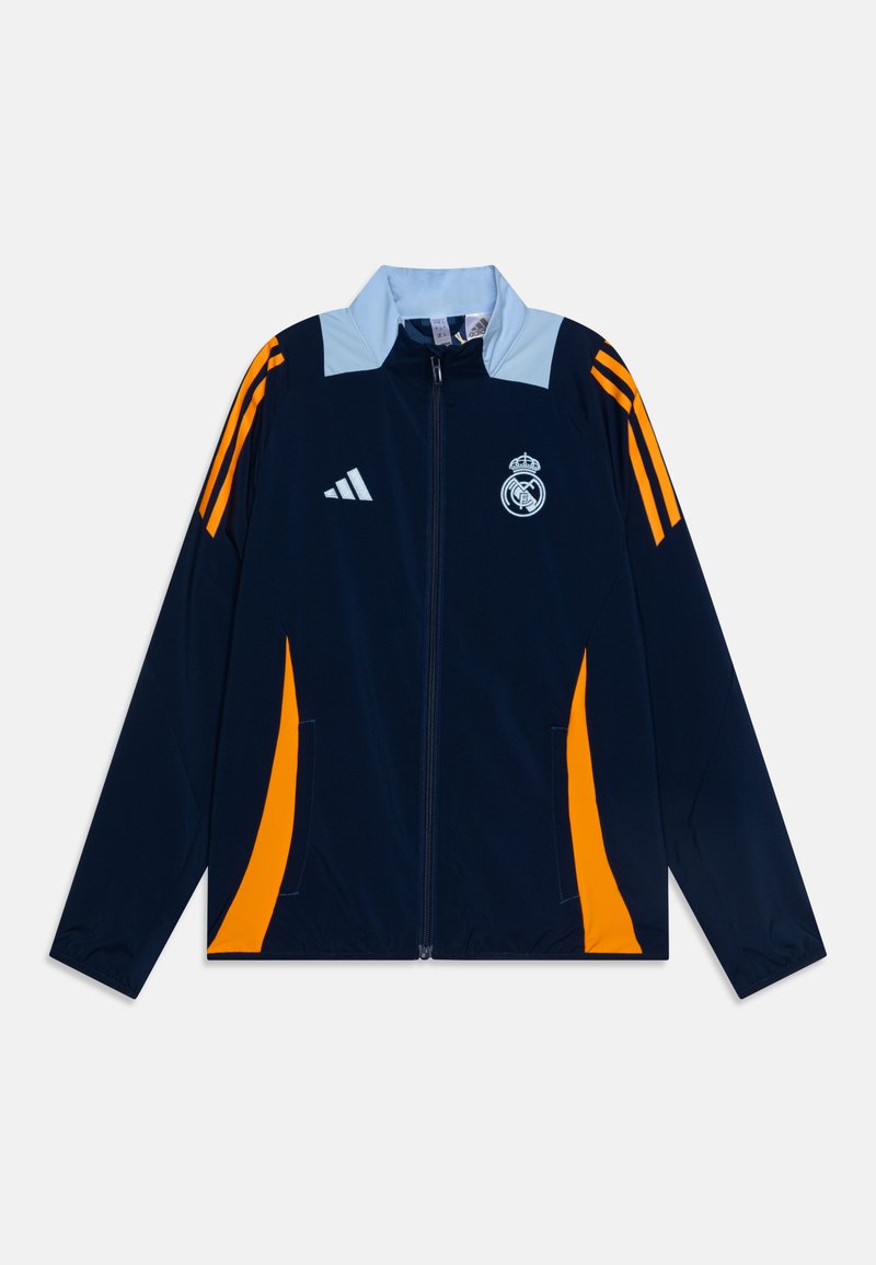 Giacca navy con collare azzurro chiaro, accenti arancioni e tre strisce arancioni sulle maniche. Presenta una zip frontale e il logo del club sul petto.