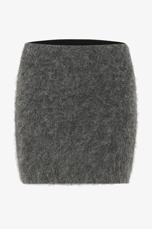 Jupe grise en feutre avec une surface douce et texturée. Forme droite, taille mi-haute, sans éléments matériels ou motifs visibles.