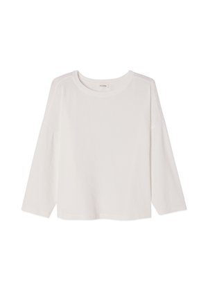 White long-sleeve ribbed knit top with round neckline and slightly loose fit, displayed flat on a white background.