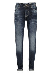Vaqueros de mezclilla azul oscuro de corte ajustado, con desgastes claros, puños enrollados, cinco bolsillos y costuras en contraste.