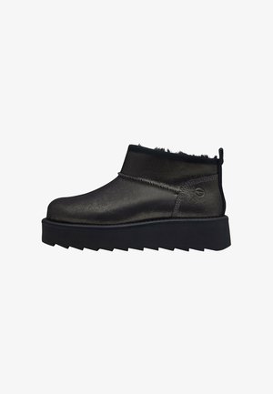 Black ankle boots with a shiny, textured surface, textile accents, and raised sole. Features a short shaft and pull tab at the back.
