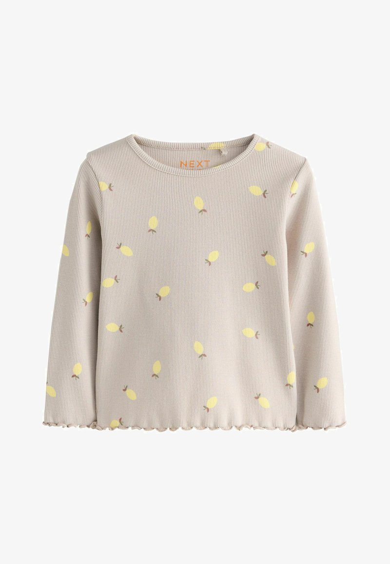 Cămașă bej cu mâneci lungi și modele galbene de frunze, textură striată, tiv ondulat și decolteu rotund. Eticheta brandului "NEXT" vizibilă la guler.