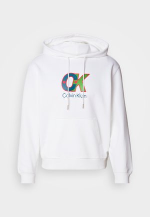 White hoodie featuring a front kangaroo pocket, drawstring hood, and a colorful "OK" logo with "Calvin Klein" text in blue.