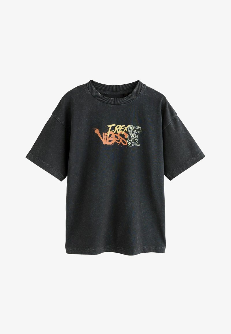 Sort oversized t-shirt med korte ærmer, der har et farverigt "T-Rex Vibes" grafikdesign. Fremstillet af bomuldsstof med en tekstureret overflade.