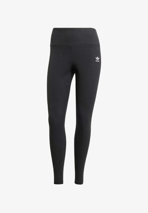 Black leggings made of ribbed fabric with a high waistband and a small white Adidas logo on the left hip. Smooth texture throughout.