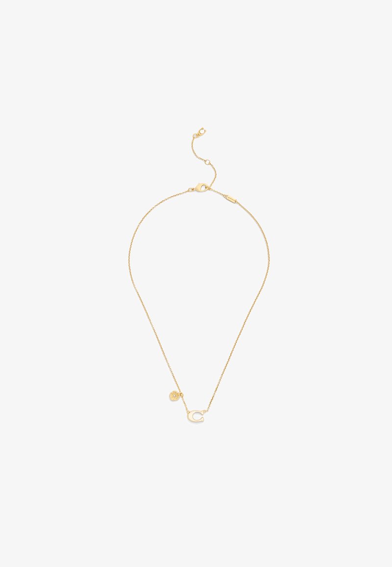 Collier délicat en chaîne d'or avec petit pendentif en forme de fleur et pendentif en forme de fer à cheval, doté d'un fermoir mousqueton et d'une rallonge de chaîne réglable.