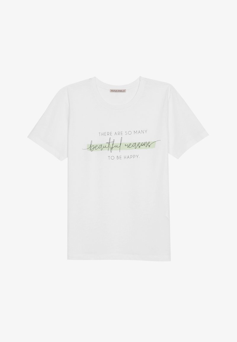 Camiseta de algodón blanca con mangas cortas y cuello redondo, con texto impreso en negro y verde: "hay tantas razones hermosas para ser feliz."