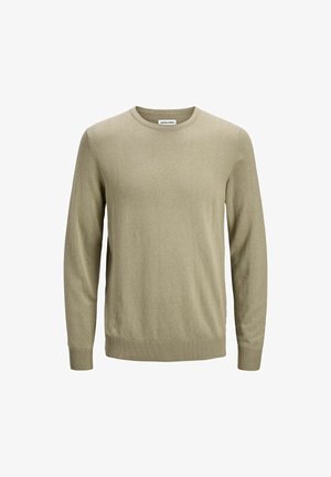 Kerge oliivroheline sviiter, mis on valmistatud pehmest kangast ning millel on pikad varrukad, ümar kaelus ja soonikpidemed ning -äär. Lihtne, ilma kaunistusteta disain.