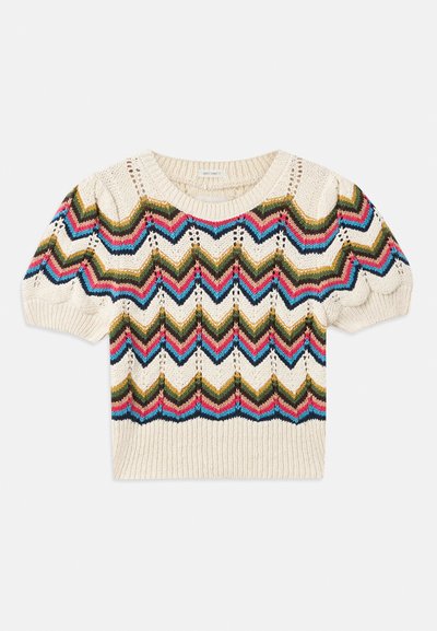 Pull en tricot avec une base crème et des motifs en zigzag verts, rouges, bleus et noirs. Manches courtes et col et ourlet côtelés.