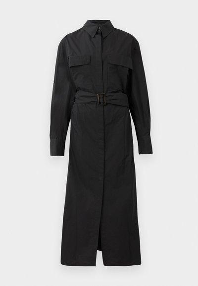 Black long-sleeve shirt dress with collar, two chest pockets, front buttons, and a matching belt with a rectangular buckle.