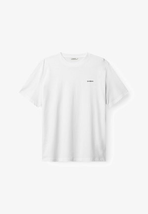 White cotton t-shirt with a crew neckline and short sleeves. Features a small black "GABBA" logo on the left chest. Smooth texture.