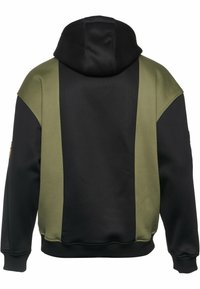 Hoodie med svart kropp och gröna sidopaneler. Tillverkad av texturerat tyg med ribbade muddar och midjeband.