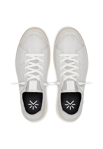 Light gray athletic shoes with a textured mesh upper, white laces, and black insoles featuring a white geometric logo.