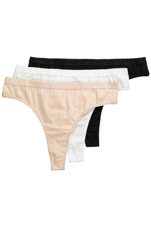 Drei Damen-Stringtangas in Beige, Weiß und Schwarz, gestapelt mit elastischen Bundabschlüssen und glatter Stoffstruktur.