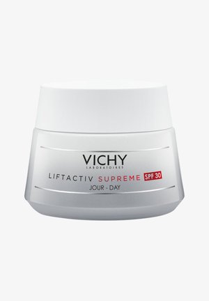 Vichy Liftactiv Supreme Cremetiegel mit weißem Deckel und silberner Basis, gekennzeichnet mit rotem SPF 30 und Produktnamen, glatte Oberflächenstruktur.