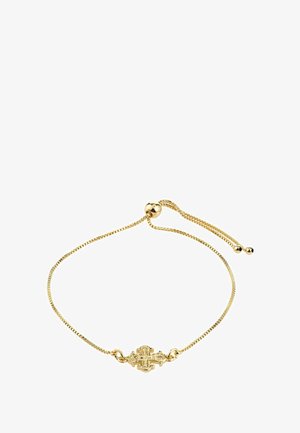 Zlatý náramok s tenkým reťazcom, so zdobenou stredovou prackou a posuvným korálikom na nastaviteľnú dĺžku. Hladká textúra.