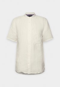Camisa de lino blanca de manga corta con cuello mao, botones frontales y bolsillo en el pecho; textura sutil y diseño limpio.