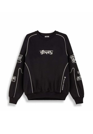 Schwarzer Sweatshirt mit weißen Akzenten und Nähten, mit verschiedenen Logos und Texten an den Ärmeln, rundem Ausschnitt und gerippten Bündchen.