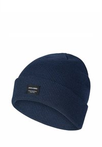 Marineblauwe gebreide muts met een geribbelde structuur en een opgerolde boord. Voorzien van een klein zwart label met witte tekst.