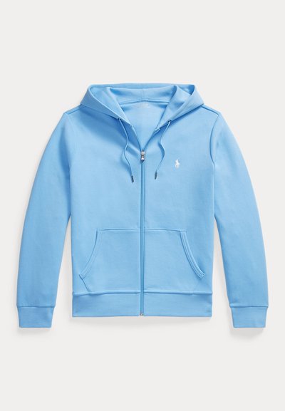 Hele sinine lukuga kapuutsiga pusa esitaskute, paelaga kapuutsi ja väikese valge logoga vasakul rinnal.