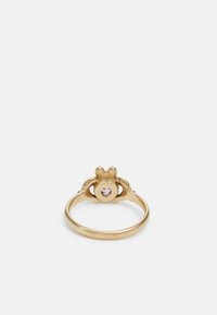 Gold ring featuring a central heart-shaped stone and ornate design with small details, smooth band, and textured accents.