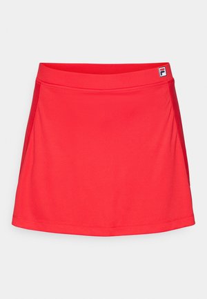 Red athletic skirt made of smooth, stretchy fabric. Features a fitted waistband and side seams, with a small logo on the waistband.