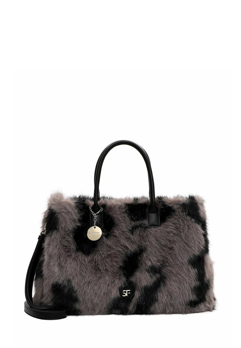 Faux fur handbag featuring brown and black patterns, black leather handles, and a silver charm attached. Rectangular shape with soft texture.