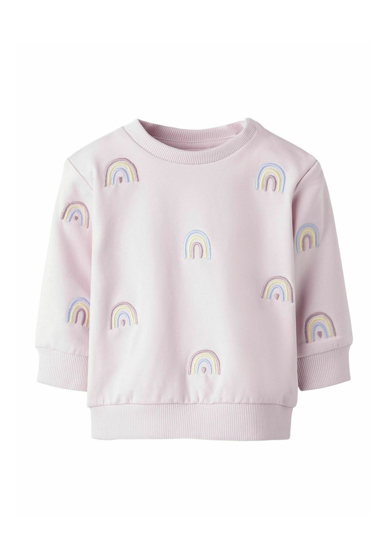 Roosa lühikeste varrukatega sviiter, millel on mitmevärvilised tikitud vikerkaared, mis on jaotatud kangale. Ribbitud äär ja varrukad.