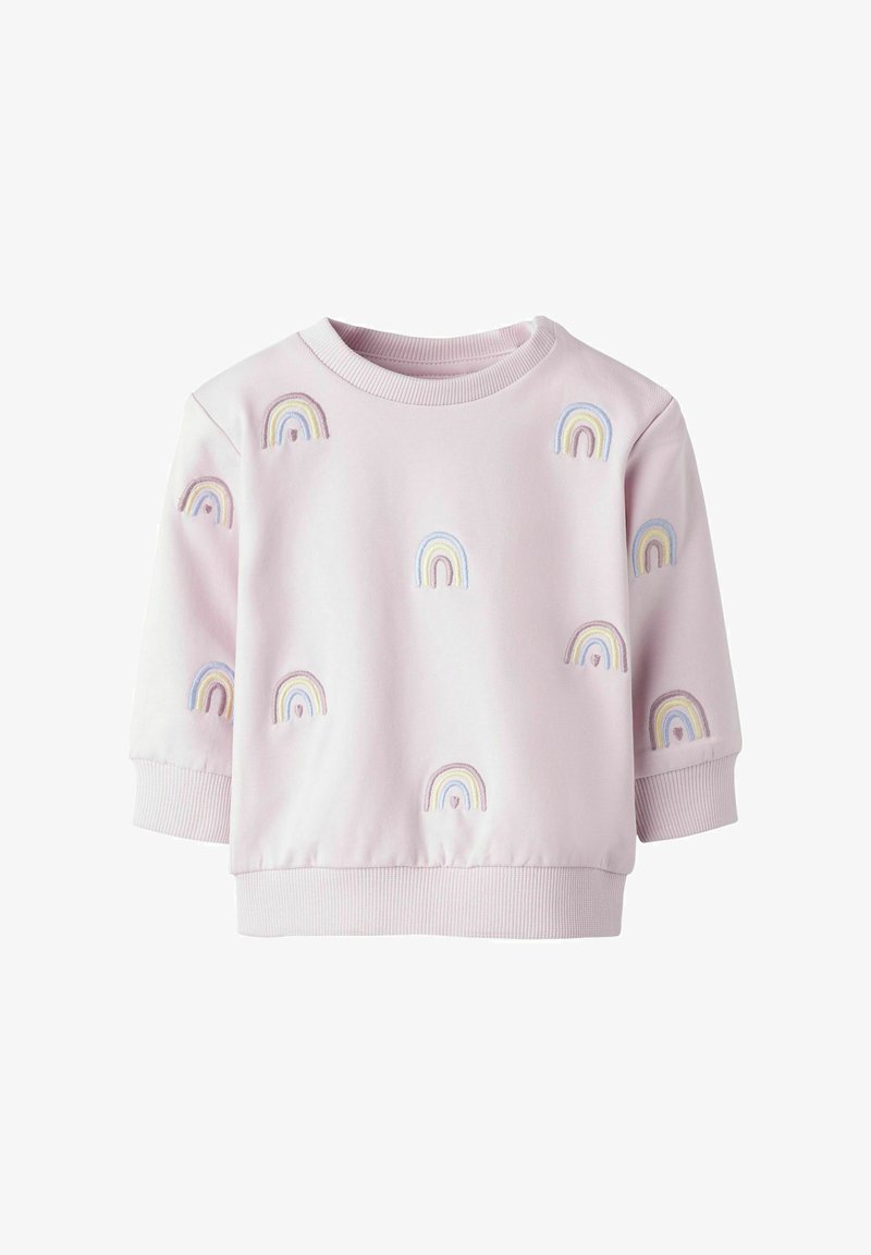 Roosa lühikeste varrukatega sviiter, millel on mitmevärvilised tikitud vikerkaared, mis on jaotatud kangale. Ribbitud äär ja varrukad.