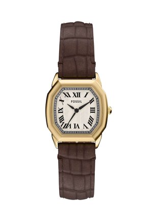 Montre fossile octogonale avec un boîtier doré, un cadran texturé blanc, des chiffres romains et un bracelet en cuir brun foncé embossé.