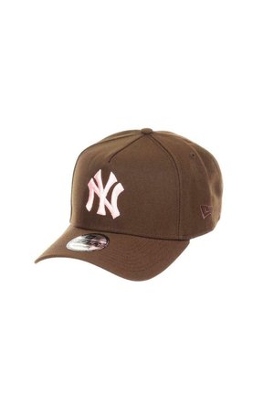 Brown baseball cap with a pink embroidered New York Yankees logo. Features a structured front, curved brim, and fabric adjustable closure.
