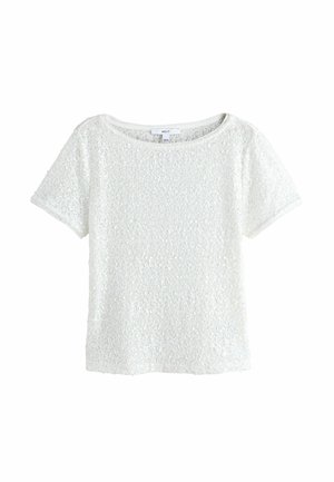 Weißes Damenoberteil mit kurzen Ärmeln, bedeckt mit kleinen glänzenden Pailletten, mit rundem Ausschnitt und einem "NEXT" Markenetikett.