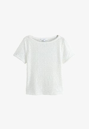 Weißes Damenoberteil mit kurzen Ärmeln, bedeckt mit kleinen glänzenden Pailletten, mit rundem Ausschnitt und einem "NEXT" Markenetikett.