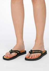 Black flip-flops with embroidered straps, featuring a textured black sole and a brown footbed, designed for comfort and casual wear.