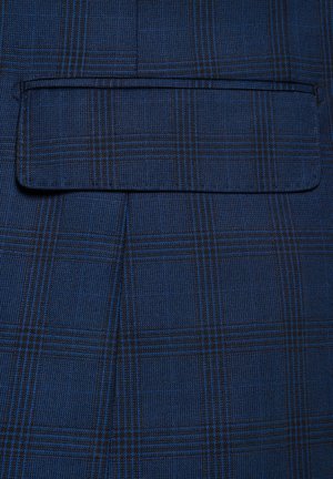 Granatowa tkanina w kratkę z czarnymi akcentami; zawiera kieszeń z prostym klapkiem.