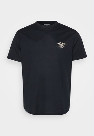 T-shirt en coton noir à manches courtes, col rond et petit logo brodé blanc sur la poitrine gauche. Textura lisse, design décontracté.