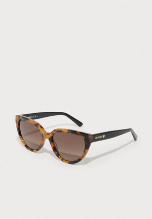Ochelari de soare cu ramă țestoasă, lentile maro cu degradé, rame ovale supradimensionate, brațe negre cu logo-ul 'Love Moschino' în auriu.