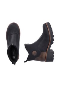 Bottines en cuir noir avec une fermeture éclair sur le côté, accents texturés noir et brun, et une semelle robuste. Présente un détail logo rond.