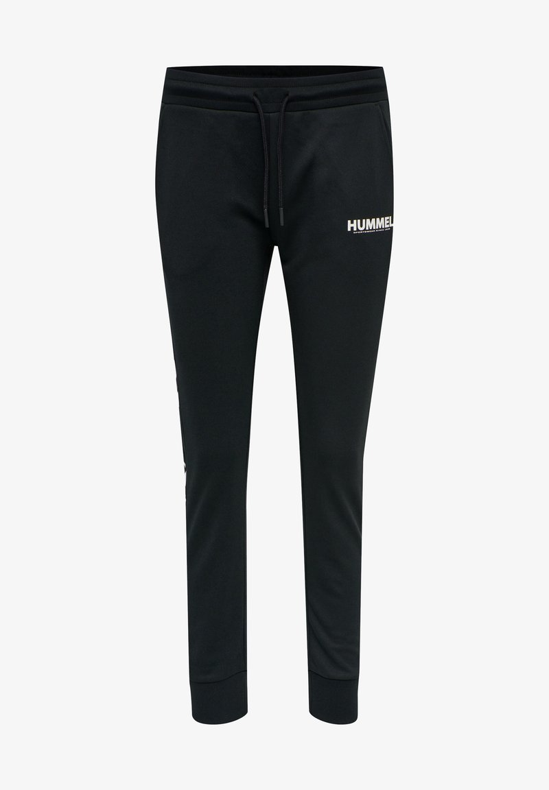 Zwarte sweatpants met een trekkoord in de taille, taps toelopend ontwerp en een witte "HUMMEL" logo gedrukt aan de voorkant. Zachte stof textuur.