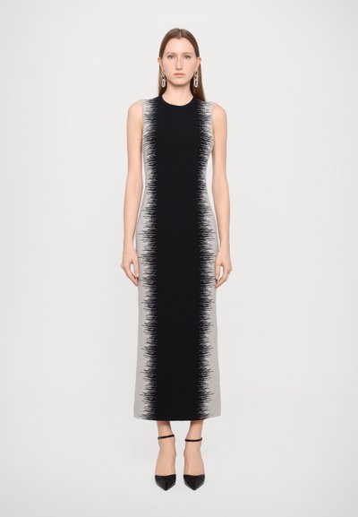 Long, fitted black and light gray dress with a textured design fading from black to gray, sleeveless, round neckline, and a smooth fabric finish.
