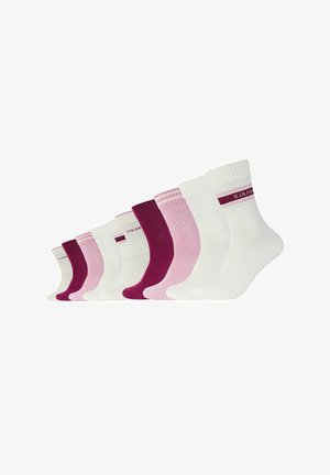 Set of eight socks featuring a mix of white, pink, and burgundy colors. Socks have ribbed texture and printed branding on the cuffs.