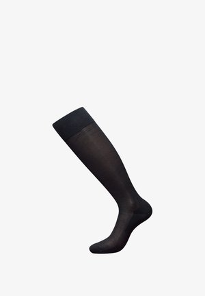 Calcetines negros hasta la rodilla con un puño acanalado, hechos de material transparente, con una textura suave y una forma ajustada.
